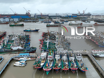 A large number of fishing boats moor at Shenjiamen Fishing Port to take shelter from Typhoon Pulasan in Zhoushan, China, on September 19, 20...