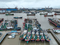 A large number of fishing boats moor at Shenjiamen Fishing Port to take shelter from Typhoon Pulasan in Zhoushan, China, on September 19, 20...