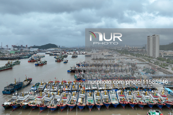 A large number of fishing boats moor at Shenjiamen Fishing Port to take shelter from Typhoon Pulasan in Zhoushan, China, on September 19, 20...