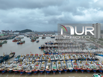 A large number of fishing boats moor at Shenjiamen Fishing Port to take shelter from Typhoon Pulasan in Zhoushan, China, on September 19, 20...