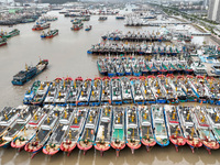 A large number of fishing boats moor at Shenjiamen Fishing Port to take shelter from Typhoon Pulasan in Zhoushan, China, on September 19, 20...