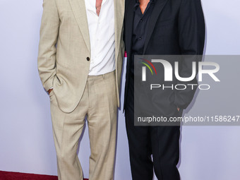 Brad Pitt and George Clooney arrive at the Los Angeles Premiere Of Apple TV+'s 'Wolfs' held at the TCL Chinese Theatre IMAX on September 18,...