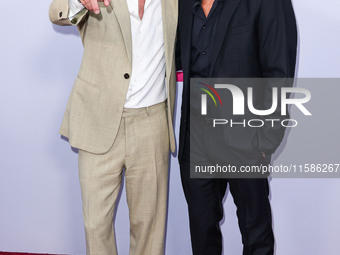 Brad Pitt and George Clooney arrive at the Los Angeles Premiere Of Apple TV+'s 'Wolfs' held at the TCL Chinese Theatre IMAX on September 18,...