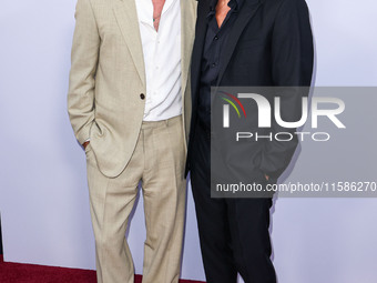 Brad Pitt and George Clooney arrive at the Los Angeles Premiere Of Apple TV+'s 'Wolfs' held at the TCL Chinese Theatre IMAX on September 18,...