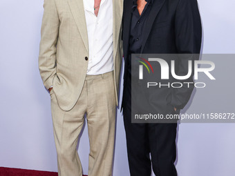 Brad Pitt and George Clooney arrive at the Los Angeles Premiere Of Apple TV+'s 'Wolfs' held at the TCL Chinese Theatre IMAX on September 18,...