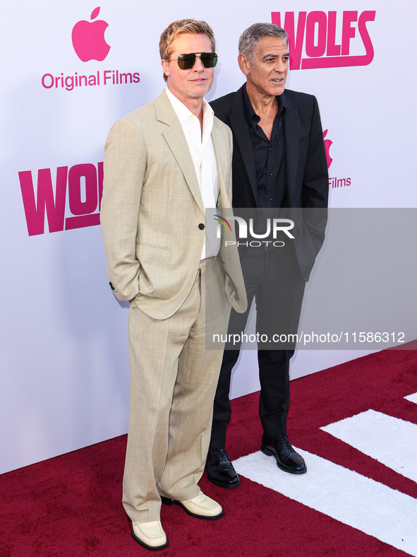 Brad Pitt and George Clooney arrive at the Los Angeles Premiere Of Apple TV+'s 'Wolfs' held at the TCL Chinese Theatre IMAX on September 18,...