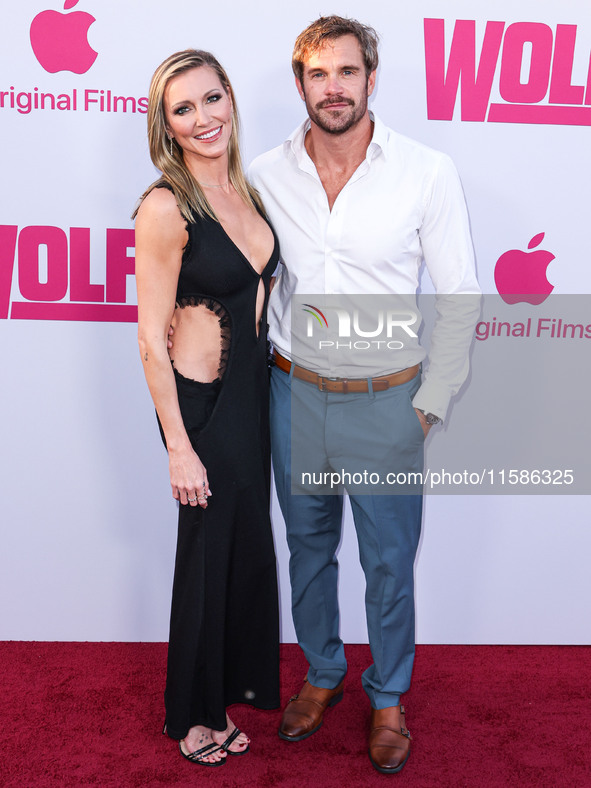 Katie Cassidy and Stephen Huszar arrive at the Los Angeles Premiere Of Apple TV+'s 'Wolfs' held at the TCL Chinese Theatre IMAX on September...