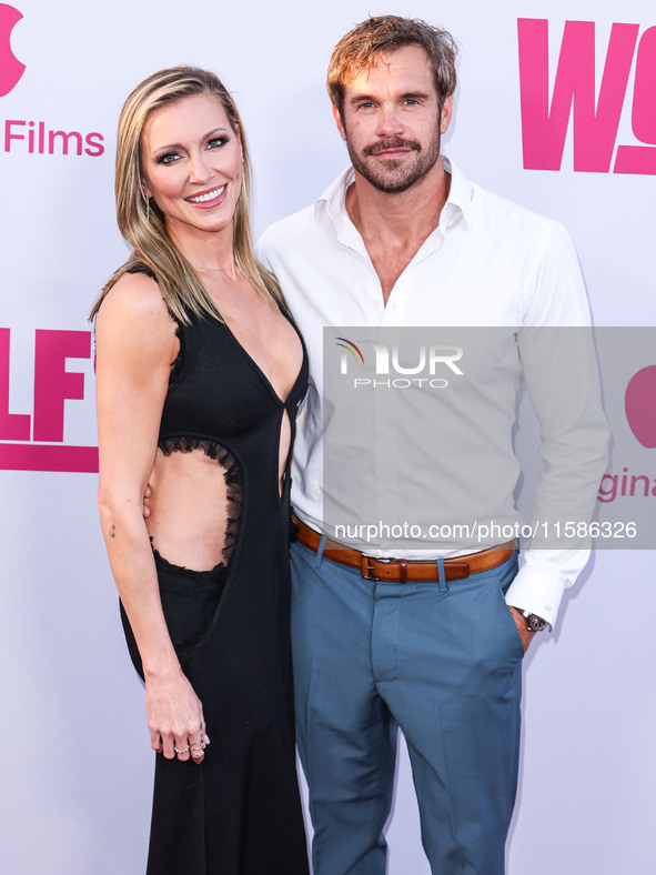 Katie Cassidy and Stephen Huszar arrive at the Los Angeles Premiere Of Apple TV+'s 'Wolfs' held at the TCL Chinese Theatre IMAX on September...