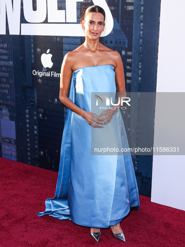 Poorna Jagannathan wearing Prada arrives at the Los Angeles Premiere Of Apple TV+'s 'Wolfs' held at the TCL Chinese Theatre IMAX on Septembe...