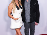 Allison Dunbar and Ron Perlman arrive at the Los Angeles Premiere Of Apple TV+'s 'Wolfs' held at the TCL Chinese Theatre IMAX on September 1...