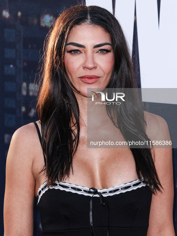 Jessica Szohr arrives at the Los Angeles Premiere Of Apple TV+'s 'Wolfs' held at the TCL Chinese Theatre IMAX on September 18, 2024 in Holly...