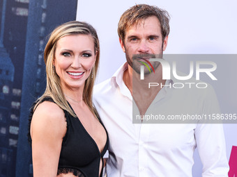 Katie Cassidy and Stephen Huszar arrive at the Los Angeles Premiere Of Apple TV+'s 'Wolfs' held at the TCL Chinese Theatre IMAX on September...