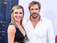 Katie Cassidy and Stephen Huszar arrive at the Los Angeles Premiere Of Apple TV+'s 'Wolfs' held at the TCL Chinese Theatre IMAX on September...