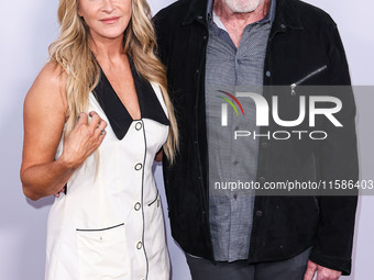 Allison Dunbar and Ron Perlman arrive at the Los Angeles Premiere Of Apple TV+'s 'Wolfs' held at the TCL Chinese Theatre IMAX on September 1...