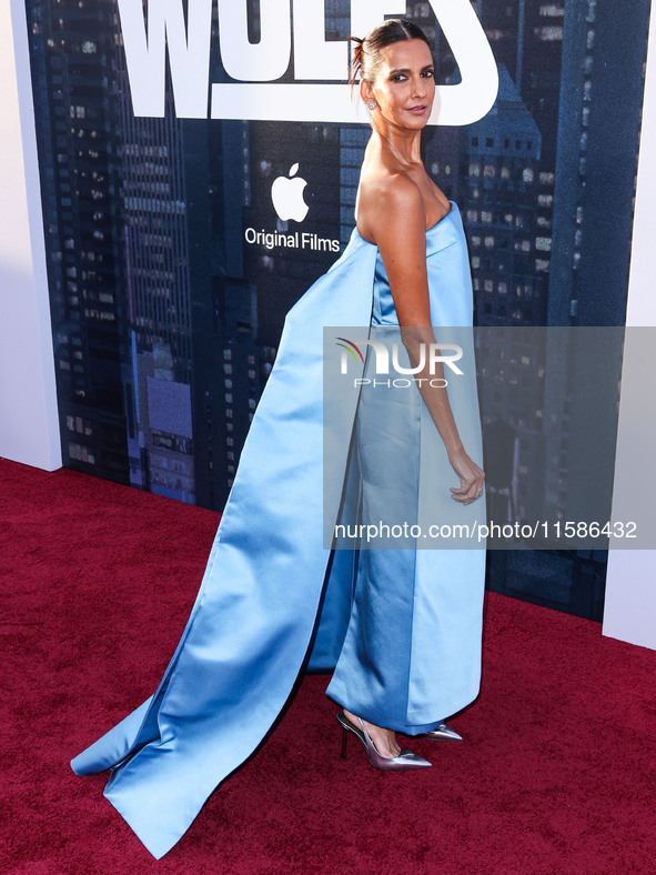 Poorna Jagannathan wearing Prada arrives at the Los Angeles Premiere Of Apple TV+'s 'Wolfs' held at the TCL Chinese Theatre IMAX on Septembe...