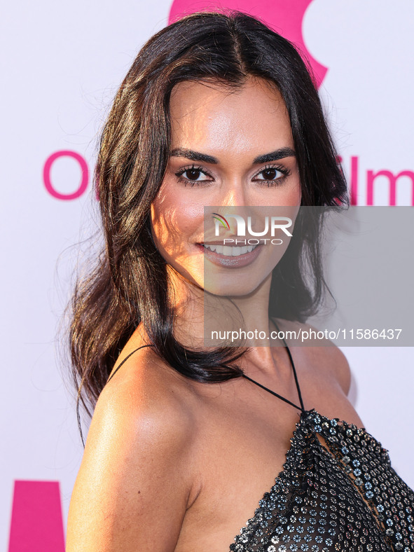 Gizele Oliveira arrives at the Los Angeles Premiere Of Apple TV+'s 'Wolfs' held at the TCL Chinese Theatre IMAX on September 18, 2024 in Hol...