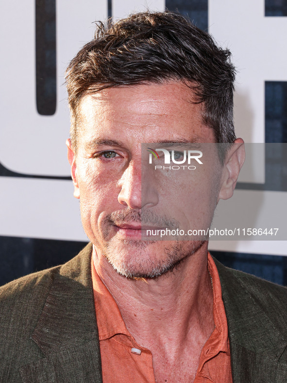 Simon Rex arrives at the Los Angeles Premiere Of Apple TV+'s 'Wolfs' held at the TCL Chinese Theatre IMAX on September 18, 2024 in Hollywood...