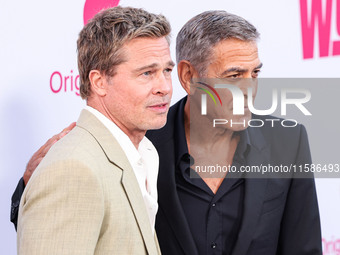 Brad Pitt and George Clooney arrive at the Los Angeles Premiere Of Apple TV+'s 'Wolfs' held at the TCL Chinese Theatre IMAX on September 18,...