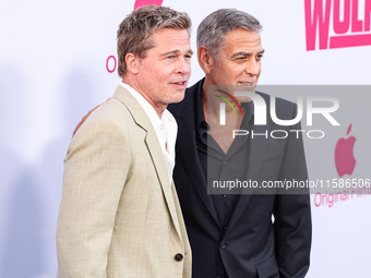 Brad Pitt and George Clooney arrive at the Los Angeles Premiere Of Apple TV+'s 'Wolfs' held at the TCL Chinese Theatre IMAX on September 18,...