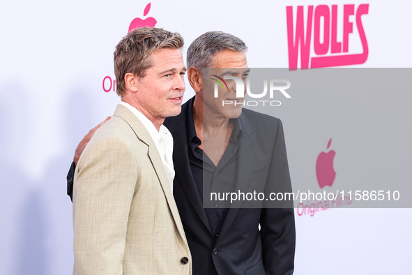 Brad Pitt and George Clooney arrive at the Los Angeles Premiere Of Apple TV+'s 'Wolfs' held at the TCL Chinese Theatre IMAX on September 18,...