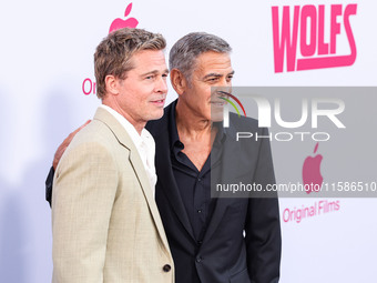 Brad Pitt and George Clooney arrive at the Los Angeles Premiere Of Apple TV+'s 'Wolfs' held at the TCL Chinese Theatre IMAX on September 18,...