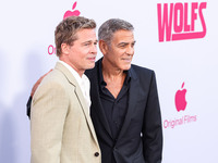 Brad Pitt and George Clooney arrive at the Los Angeles Premiere Of Apple TV+'s 'Wolfs' held at the TCL Chinese Theatre IMAX on September 18,...