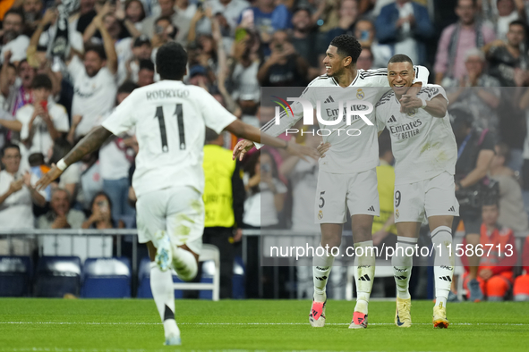 Kylian Mbappe centre-forward of Real Madrid and France celebrates after scoring his sides first goal with Jude Bellingham and Rodrygo Goes...