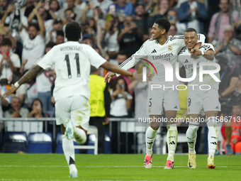 Kylian Mbappe centre-forward of Real Madrid and France celebrates after scoring his sides first goal with Jude Bellingham and Rodrygo Goes...