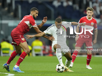 Kylian Mbappe centre-forward of Real Madrid and France and Josha Vagnoman right-back of Stuttgart and Germany compete for the ball during th...