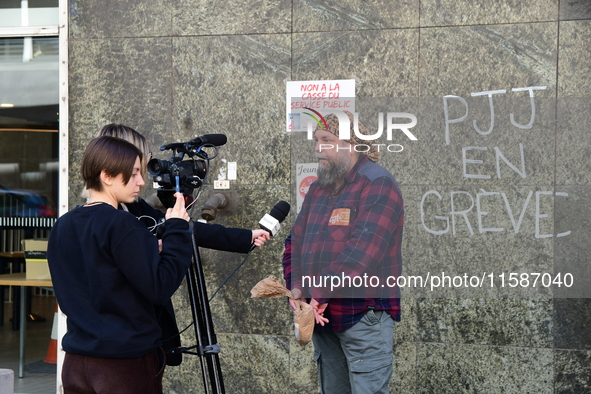 Several CGT demonstrators in front of the Lyon court protest against the elimination of posts in the youth judicial police in Lyon, France,...