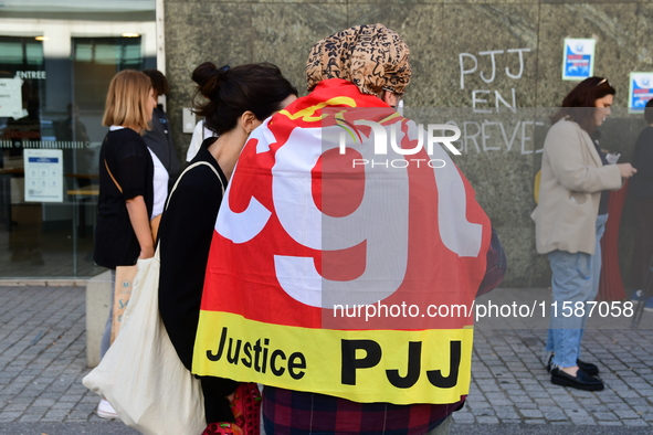 Several CGT demonstrators in front of the Lyon court protest against the elimination of posts in the youth judicial police in Lyon, France,...