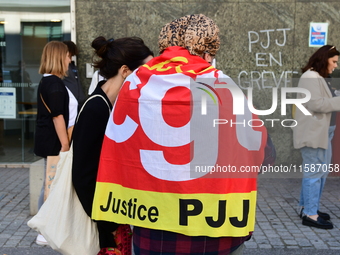 Several CGT demonstrators in front of the Lyon court protest against the elimination of posts in the youth judicial police in Lyon, France,...