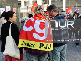 Several CGT demonstrators in front of the Lyon court protest against the elimination of posts in the youth judicial police in Lyon, France,...