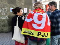 Several CGT demonstrators in front of the Lyon court protest against the elimination of posts in the youth judicial police in Lyon, France,...