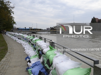 Sandbags sit against the river banks during high waters in the Oder River in Wroclaw, Poland, on September 19, 2024. (