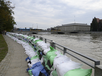 Sandbags sit against the river banks during high waters in the Oder River in Wroclaw, Poland, on September 19, 2024. (