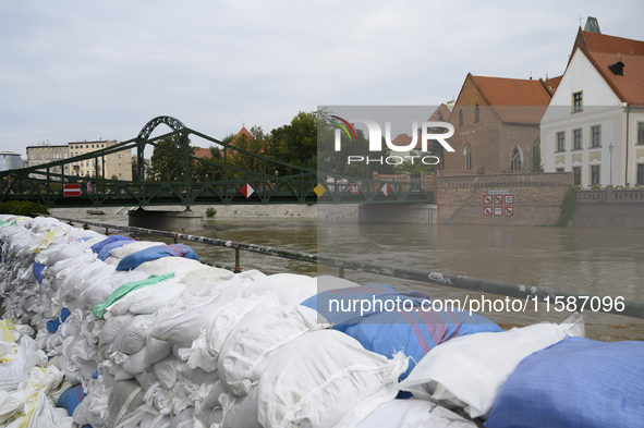 Sandbags sit against the river banks during high waters in the Oder River in Wroclaw, Poland, on September 19, 2024. 