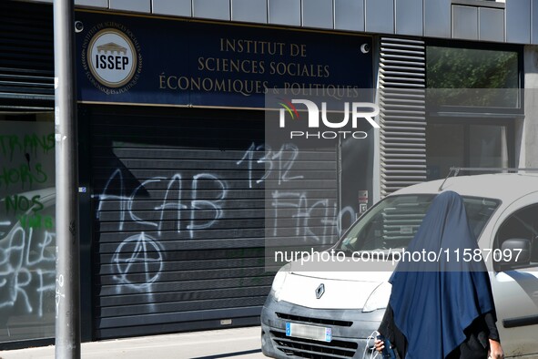 Several tags appear on the Institute of Social, Economic and Political Sciences, Marion Marechal's school, against the arrival of Marguerite...