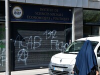 Several tags appear on the Institute of Social, Economic and Political Sciences, Marion Marechal's school, against the arrival of Marguerite...