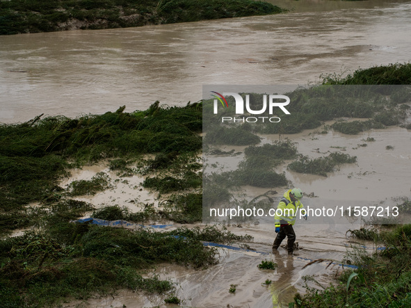 Civil protection operates along the Lamone River during the flood in Faenza, Emilia-Romagna, on September 19, 2024. 