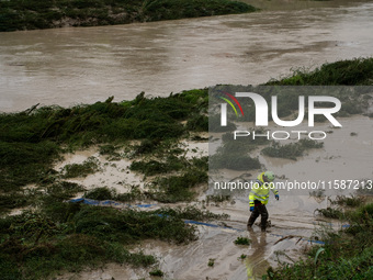 Civil protection operates along the Lamone River during the flood in Faenza, Emilia-Romagna, on September 19, 2024. (