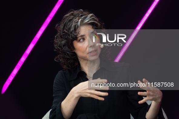 Meredith Whittaker, Co-Founder of AI Now Institute Signal, speaks at Media Park on the second day of Deutsche Telekom's Digital X event in C...