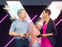 Peter Koerte, Chief Technology and Chief Strategy Officer of Siemens AG, and Annabelle Mandeng, a German actress, speak at Media Park on the...