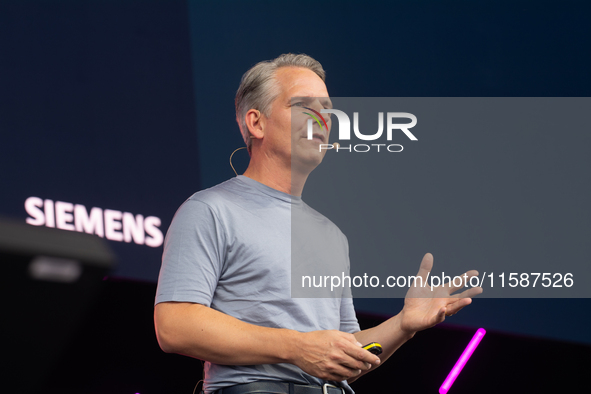 Peter Koerte, Chief Technology and Chief Strategy Officer of Siemens AG, speaks at Media Park on the second day of Deutsche Telekom's Digita...