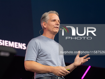 Peter Koerte, Chief Technology and Chief Strategy Officer of Siemens AG, speaks at Media Park on the second day of Deutsche Telekom's Digita...