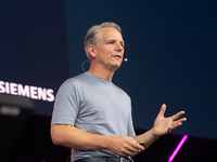 Peter Koerte, Chief Technology and Chief Strategy Officer of Siemens AG, speaks at Media Park on the second day of Deutsche Telekom's Digita...