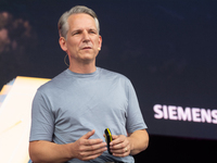 Peter Koerte, Chief Technology and Chief Strategy Officer of Siemens AG, speaks at Media Park on the second day of Deutsche Telekom's Digita...