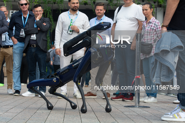 A robot dog walks at Media Park on the second day of Deutsche Telekom's Digital X event in Cologne, Germany, on September 18, 2024. 