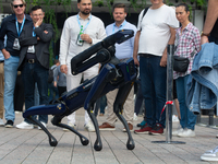 A robot dog walks at Media Park on the second day of Deutsche Telekom's Digital X event in Cologne, Germany, on September 18, 2024. (