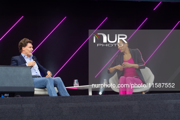 Carsten Maschmeyer, an international startup investor, and Annabelle Mandeng, a German actress, speak at Media Park on the second day of Deu...